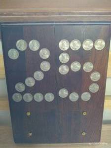 lot 307 image: Wooden 25 Plaque With 25 Inset Susan B Anthony Dollars