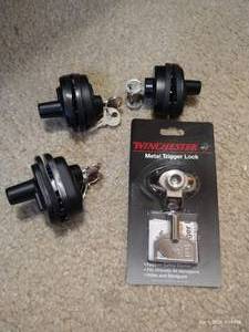 lot 320 image: 4 Trigger Locks - 1 New - 2 Franzen, 1 Winchester, 1 Unbranded