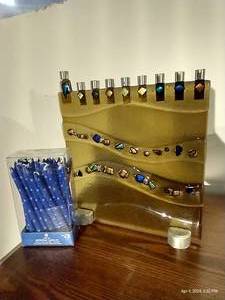 lot 733 image: Unique Glass Menorah & Package of Menorah Candles