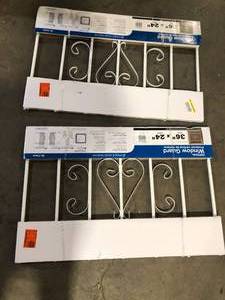 Lot of  Unique Home Designs 36 in. x 24 in. Su Casa White 7-Bar Window Guard     Customer Returns See Pictures