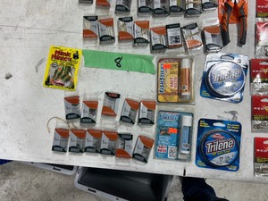 TABLE FULL OF FISHING PLASTICS