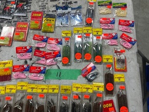 TABLE FULL OF FISHING PLASTICS