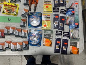 TABLE FULL OF FISHING PLASTICS