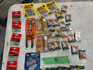 TABLE FULL OF FISHING PLASTICS