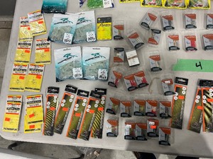 TABLE FULL OF FISHING PLASTICS