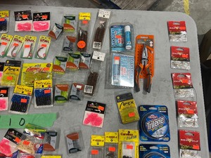 TABLE FULL OF FISHING PLASTICS
