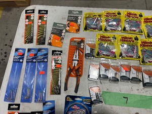 TABLE FULL OF FISHING PLASTICS