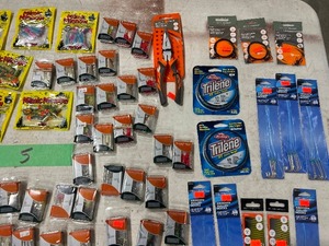 TABLE FULL OF FISHING PLASTICS