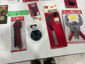 TABLE FULL OF AUTO SPECIALTY TOOLS