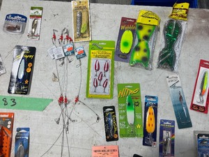 TABLE FULL OF FISHING SPOONS