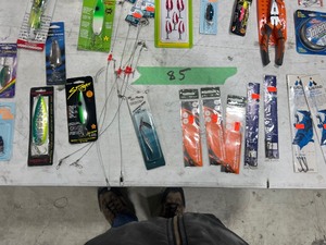 TABLE FULL OF FISHING SPOONS