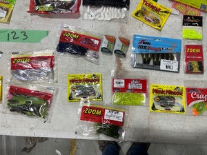 TABLE FULL OF FISHING PLASTICS