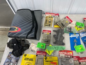 TABLE FULL OF ARCHERY ITEMS