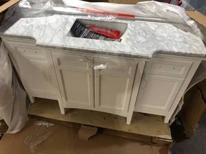 lot 10 image: Home Decorators Collection Sassy 60 in. W x 22 in. D x 34 in. H Single Sink Bath Vanity in White with Carrara Marble Top  Customer Returns See Pictures