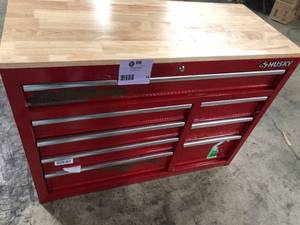 lot 24 image: Husky 42 in. W x 18.1 in. D 8-Drawer Red Mobile Workbench Cabinet with Solid Wood Top Rusted    Customer Returns See Pictures
