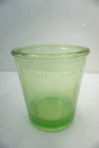 lot 146 image: Green glass measuring cup