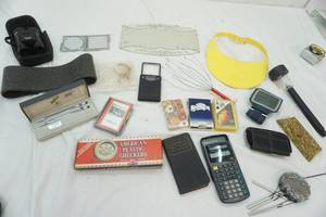 lot 232 image: Binoculars, Pens, playing cards, calculator,