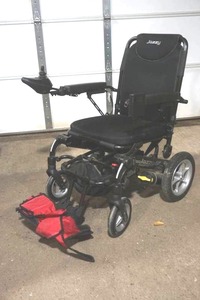 lot 274 image: Jazzy Pasport Electric Chair with Owners Manual