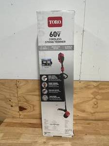 lot 174 image: TORO 60V MAX 13 in. (33.0 cm)  15 in. (38.1 cm) Brushless String Trimmer with 2.0Ah Battery & Charger (Retails for $189.99)