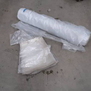 HUGE ROLL OF PLASTIC AND A BUNCH OF PLASTIC BAGS