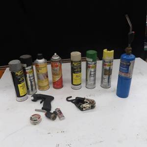 DIFFERENT VARIETY OF SPRAY PAINT, A PROPANE TORCH, A NEW TORCH HEAD