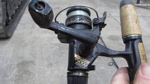 lot 71 image: (3) Spinning Reels on Fishing Poles