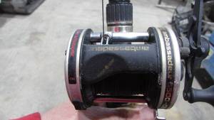 lot 72 image: (2) Bait Caster Reels On Heavy Fishing Poles