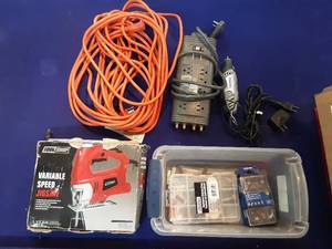 lot 150 image: Dremel tool with accessories, Tool shop Jigsaw, extension cord, multiplug