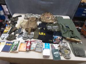 lot 22 image: Large Lot of Military Clothes, Books, Gear and More.
