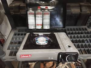 lot 48 image: Coleman Butane Camp Stove with Case and 3 Cans of Butane