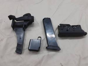 lot 64 image: 2 magazine speed loaders Savage and other mag