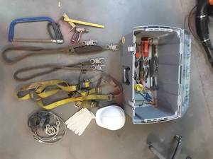 lot 83 image: tote with hand tools and safety gear