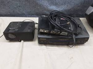 lot 94 image: GPX Bluetooth mini projector, VCR and digital converter box.
