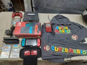 lot 95 image: Nintend Switch with Charger and case. super Mario Sweatsuit size xl, Nintendo n64, gameboy advance sp.