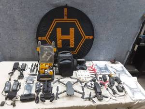 lot 102 image: DJI Mavic pro and parrot drone parts with controllers, chargers and bags