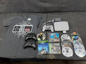 lot 133 image: Sony Playstation with power cord, Remote, Games, memory card and other video game related.