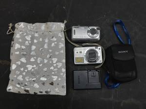 lot 134 image: 2 Sony Cybershot digital cameras, charger, and case