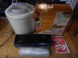 lot 38 image: Nesco Food Dehydrator with 8 Trays and Foodsaver with bags