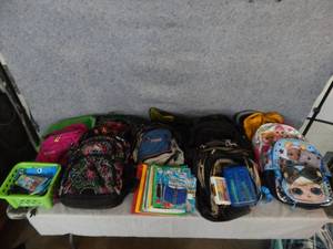 lot 127 image: Backpacks and assorted school supplies.