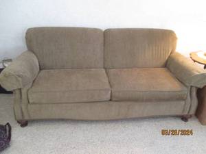 lot 10 image: Dark neutral tone sofa with nailhead detailed edges