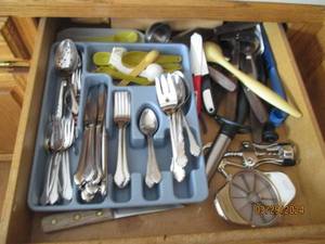 lot 75 image: Drawer full of stainless steel flatware, compartmentalized organizer and assorted lot of other kitchen aids and supplies
