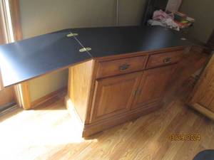 lot 78 image: Heavy duty wood kitchen island with 2-drawers, 2-doors with inner storage ledge and dual side flip open capacity to expand the surface area for endless opportunities. (approximately401730)