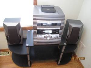 lot 97 image: GPX PLL digital tuning AMFM stereo Tuner, dual tape cassette recorder and belt-drive turn table and bookshelf speakers and tiered shelf multi-media stand