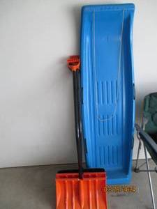 lot 119 image: Assortment of Curved handle snow shovels and a 2-man plastic Norca snow sled
