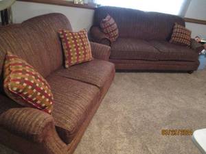 lot 144 image: Living Room Furniture matching Upholstered couch and love seat with accent pillows