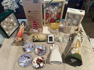 lot 210 image: Precious Moments religious implied figurine and hand carved in Bethlehem Wood Nativity figurines plus an assortment of Avon and other ornaments and gifts