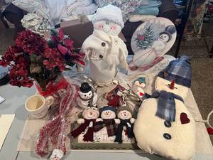 lot 219 image: Storage tote full of freestanding and wall mounting Snowman Christmas themed decor