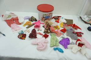 lot 1 image: Raggedy Ann & Andy Tin with Barbie and Barbie clothes