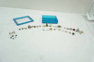 lot 44 image: Blue Container with a variety of sizes of Rings