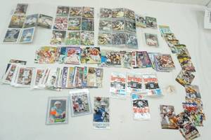 lot 49 image: Plastic Bin with a variety of football cards all ages